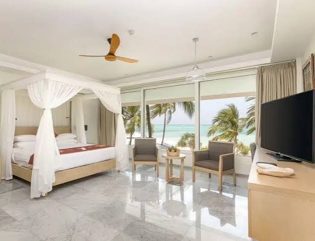 Melia Zanzibar room with canopy bed and ocean view
