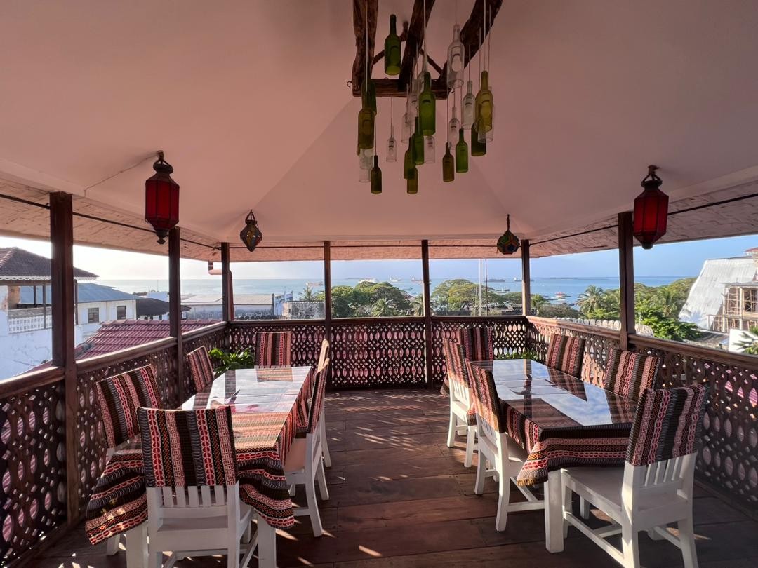 Jafferji House dining area on a balcony overlooking the ocean