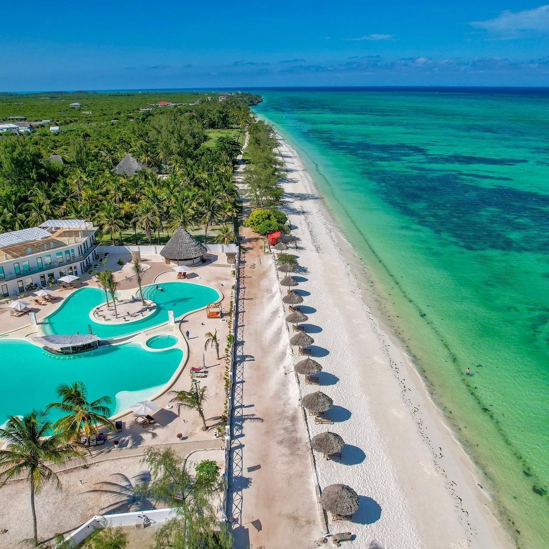 Aerial view of a beach resort and turquoise ocean in Unguja, Zanzibar