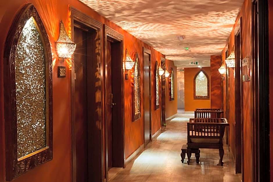 Spice Tree hotel corridor with warm lighting and wooden doors