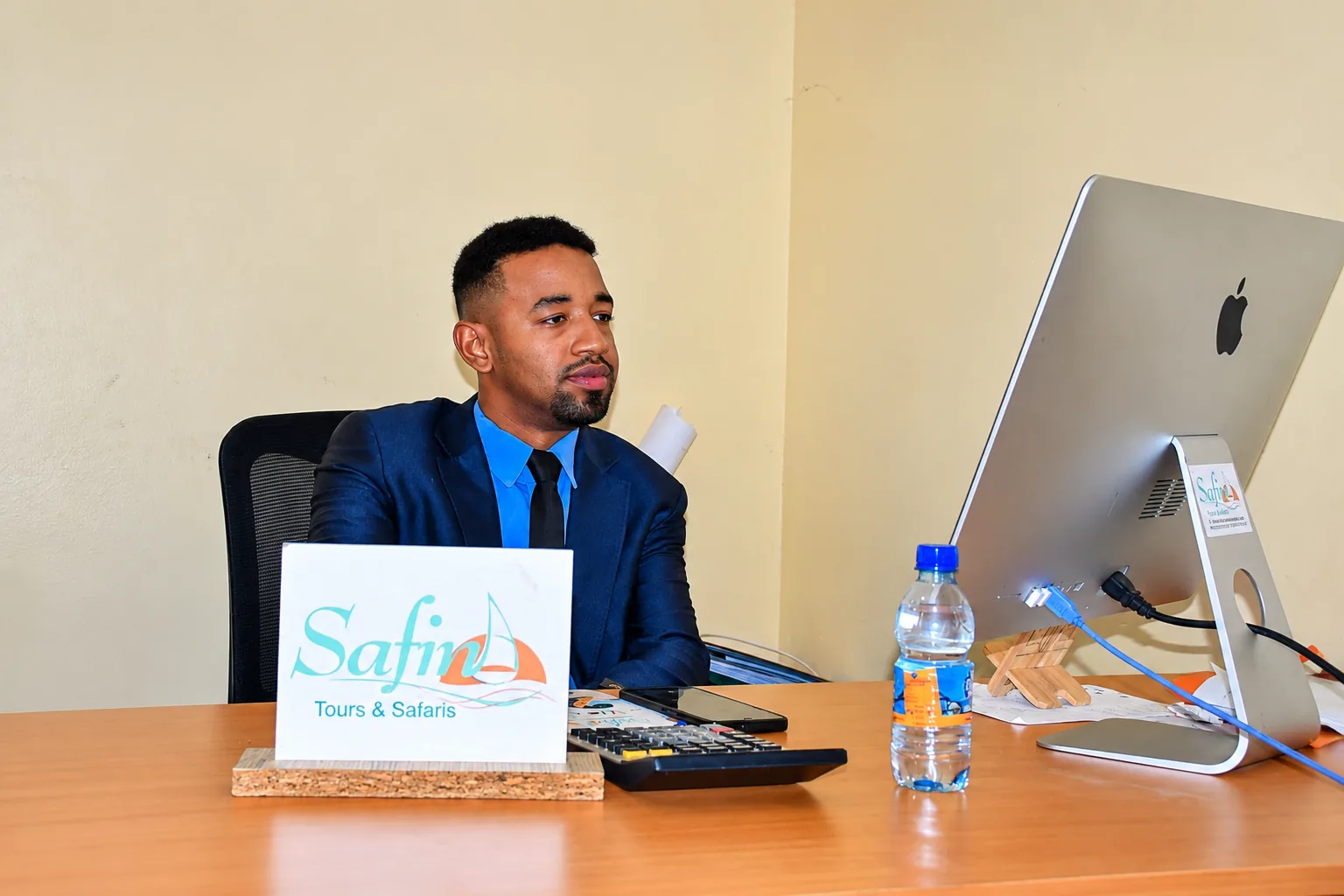 Our team member at the Safina Tours office desk in Zanzibar