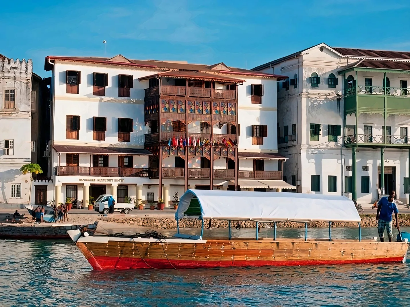 Mizingani Sea Front hotel building and boat